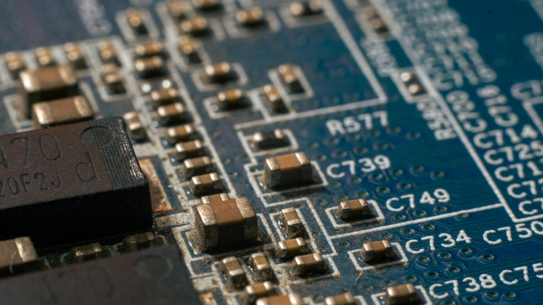 Detailed macro shot of a circuit board highlighting electronic components and traces.